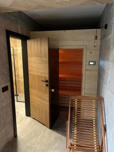 a room with a wooden door and a staircase at View & Spa Villa in Kluszkowce
