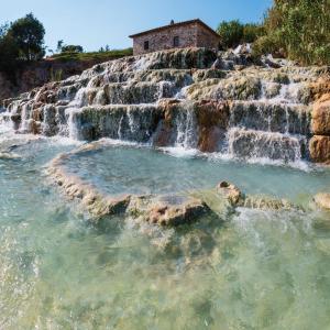 a waterfall on the side of a hill at Agriturismo Mimosa in Rispescia