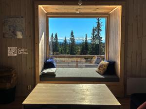 a window in a room with a view at Modern New Large Cabin Ski in out Sjusjøen in Ringsaker