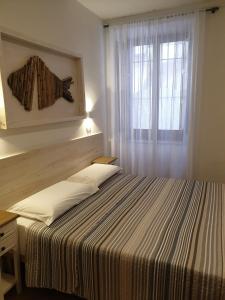 Postel nebo postele na pokoji v ubytování Kalimaka Bed & Breakfast