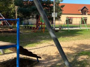 a pole in a park with a playground at Agroturystyka Staroscin in Rzepin