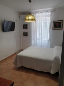 Postel nebo postele na pokoji v ubytování Kalimaka Bed & Breakfast