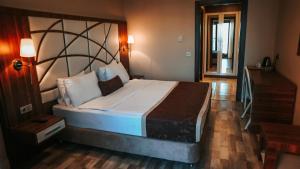a bedroom with a large bed in a room at The Grand Mira Hotel in Istanbul +46 photos