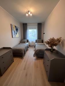 Postel nebo postele na pokoji v ubytování Kastani Apartments
