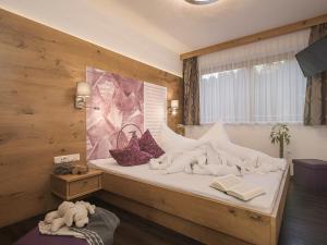 Postel nebo postele na pokoji v ubytování Apart Central – Premium Mountain&Garden
