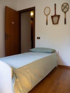 a bedroom with a bed in a room at Amazing 3 bedrooms villa with lavish garden, breathtaking lake and mountains view in Luino