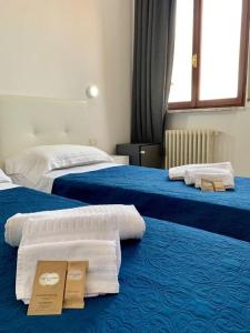 A bed or beds in a room at OASI SAN FRANCESCO ROMA
