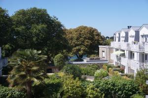 a view of the gardens of a building at Hotel Ker Vennaik in Bénodet