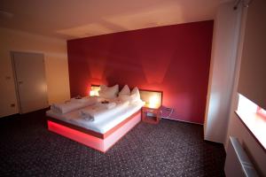 Giường trong phòng chung tại Hotel Galaxie