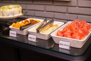 a display case with several different types of food at Premier Hotel in Votuporanga
