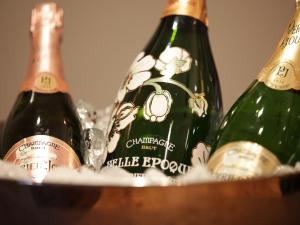 a group of three bottles of champagne in a basket at Blanch House in Brighton & Hove