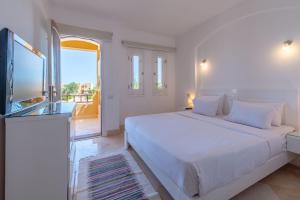 A bed or beds in a room at VESTA - El Gouna Residence Még 37 kép