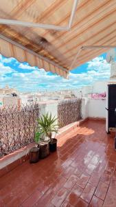 Balkón alebo terasa v ubytovaní APARTAMENTOS HÉRCULES SEVILLa