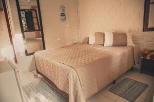 Postel nebo postele na pokoji v ubytování A Ilha Verde Hotel Pousada na Praia