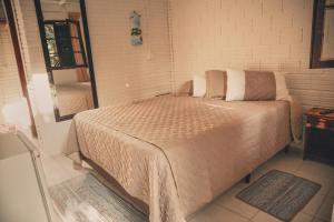 Cama ou camas em um quarto em A Ilha Verde Hotel Pousada na Praia