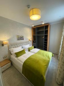 Łóżko lub łóżka w pokoju w obiekcie Hotel Radetzky