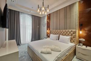 Кровать или кровати в номере Continental Hotel Samarkand