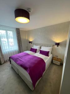 Łóżko lub łóżka w pokoju w obiekcie Hotel Radetzky