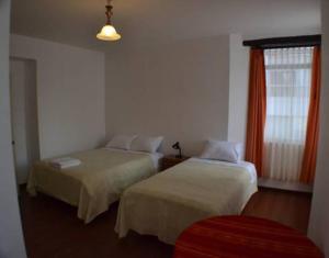 Postel nebo postele na pokoji v ubytování Heritage Inn