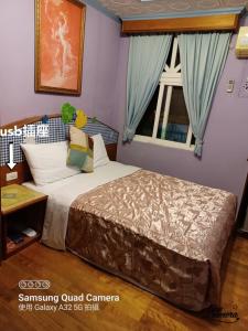 Ένα ή περισσότερα κρεβάτια σε δωμάτιο στο Heart Seed B&B