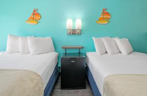 Ein Bett oder Betten in einem Zimmer der Unterkunft Beach Bum Inn