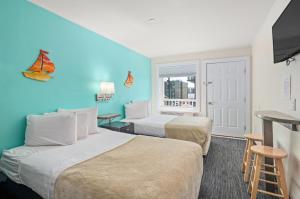 Ein Bett oder Betten in einem Zimmer der Unterkunft Beach Bum Inn