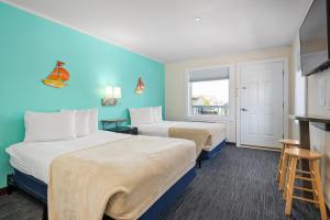 Ein Bett oder Betten in einem Zimmer der Unterkunft Beach Bum Inn