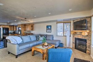 a living room with a couch and a fireplace at 2-Condo Property with Mtn Views by Golf and Ski Resort in Eden
