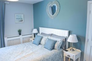 Ένα ή περισσότερα κρεβάτια σε δωμάτιο στο Turnstone - Suffolk Coastal Escapes