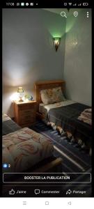 ein Bild von einem Schlafzimmer mit 2 Einzelbetten in der Unterkunft Maison Ait Mizane in Imlil