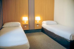 Postel nebo postele na pokoji v ubytování B&B HOTEL Metz Est Technopole Pôle Santé