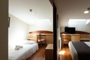 Posteľ alebo postele v izbe v ubytovaní Real Ferrol