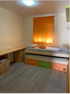 a bedroom with a bed with a window and a desk at Adosado cerca de la playa y club de buceo con piscina en calabardina, Aguilas in Calabardina +39 photos