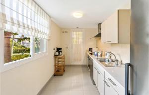 A kitchen or kitchenette at Amazing Apartment In Estepona With Wifi