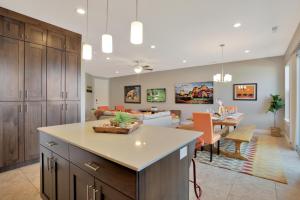 a kitchen and living room with a couch and a table at Entrada at Moab 598 and 602 in Moab
