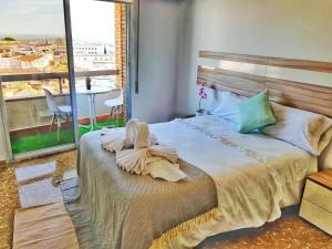 Rúm í herbergi á Panorama Córdoba Center, baño privado externo a la habitación
