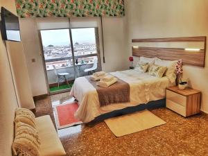 Rúm í herbergi á Panorama Córdoba Center, baño privado externo a la habitación