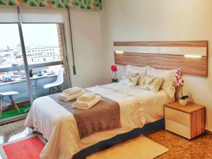Rúm í herbergi á Panorama Córdoba Center, baño privado externo a la habitación