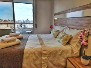 Rúm í herbergi á Panorama Córdoba Center, baño privado externo a la habitación