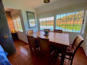 a dining room with a wooden table and chairs at Casa La Caoba in Ruidera