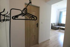 a light hanging over a door in a room at Ali4 in Sosnowiec