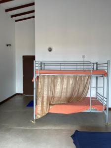 Postel nebo postele na pokoji v ubytování Sea Sands Beach Hostel
