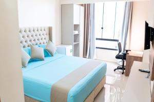 Televizorius ir (arba) pramogų centras apgyvendinimo įstaigoje Liebling Hotel Ciudad del Este