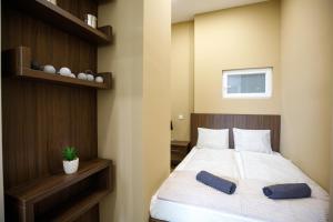 A bed or beds in a room at A37 Awesome Apartments