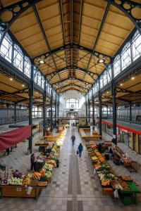 a large market with a lot of fruits and vegetables at A37 Awesome Apartments in Budapest