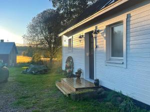 a house with a bench on the side of it at 4 person holiday home in FALK PING in Falköping