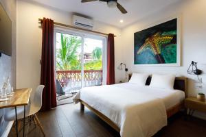 Postel nebo postele na pokoji v ubytování Divers Paradise Boutique Hotel