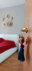 a close up of a door with a tassel on it at Sweet Home en Arquá Petrarca in Arquà Petrarca