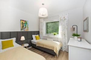 Postel nebo postele na pokoji v ubytování Słoneczne Tarasy II - Apartments