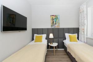 Postel nebo postele na pokoji v ubytování Słoneczne Tarasy II - Apartments